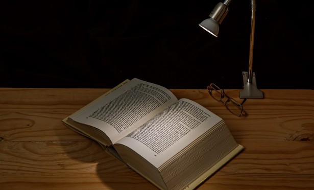 Desk lamp and book